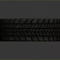 Car Tire Closeup View With Detailed Tread Pattern And Rubber Texture