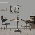 Modern Round Dining Table with Black and Light Chairs Decorative Vase Yellow Flowers and Bowl