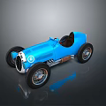 Blue Vintage Open Top Race Car With Black Seats And Silver Wheels On Dark Background