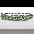 Seek The Quiet World The Hidden Leader With Green Floral Garland On White Wall
