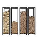 Firewood Stacked in Black Metal Frames with Various Shapes Sizes Against Light Gray Stone Wall