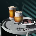 Layered Iced Coffee Drinks With Cream Topping Straws On Tray Coffee Beans And Chocolate Pieces