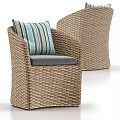 Woven Rattan Outdoor Chair With Gray Cushion And Blue White Striped Pillow