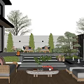 Modern Outdoor Garden With Wooden Deck Sofa Coffee Table And Green Plants