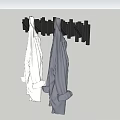 Wall Mounted Hooks Hanging White and Gray Clothes on Gray Wall