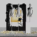 Stylish Window Display Featuring Mannequins Black Backdrop White Pedestal And Golden Decorative Elements