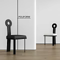 Poliform Black And White Dining Chairs With Circular Backrest In White Walls And Wooden Floor