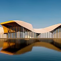 Contemporary Architectural Building With White And Yellow Geometric Design Glass Curtain Walls And Water Reflection