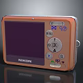 Nikon Electronic Digital Camera In Orange With LCD Screen And Control Buttons