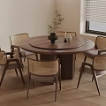 Round Wooden Dining Table With Wicker Chairs And Vase In Modern Room With Blinds