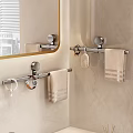 Bathroom Towel Hooks With Hanging Towels And Accessories On Beige Wall Near Mirror