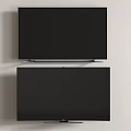 Two Televisions With Black Screens Mounted On Light Colored Wall