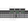 Traditional Chinese Garden Wall With Stone Lattice Panels And Green Plants