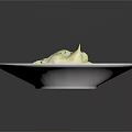 Creamy White Ravioli in Rich Sauce Garnished with Fresh Green Herbs on White Plate