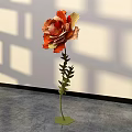 Large Paper Flower Floral Installation With Orange Yellow Petals Green Stem And Shadowy White Wall