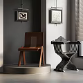 Interior Display Of Wooden And Metal Chairs With Gray Wall And Framed Paintings