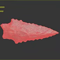 Orange Stone Arrowhead Artifact With Engraved Number 574 And Textured Surface