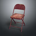 Vintage Red Folding Chair With Worn Metal Frame And Simple Background