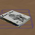 Stacked Magazine With EAT LIFE Cover Text And Person Illustration On Wooden Floor