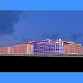 Modern Industrial Factory Building Exterior With Night Lighting And Water Reflection