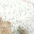Raindrops On Window Glass With Blurred Outdoor Background View