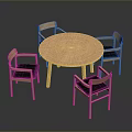 Round Wooden Dining Table With Four Chairs And Black Cushions