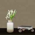 White Vase With Gold Rim Holding White Lilies Red Stamens And Green Leaves