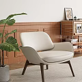 Beige Leather Leisure Chair With Wooden Legs Green Plant And Wooden Wall Decor