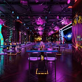 Stylish Bar Interior With Neon Lights Purple Lighting Comfortable Sofa Seats And Bar Counter