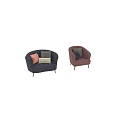 Blush Pink and Navy Blue Velvet Armchairs with Patterned Pillows and Wooden Legs
