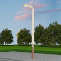 Outdoor Street Light With Blue Sky Pink Clouds Green Trees And Paved Ground