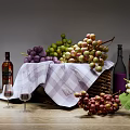 Fresh Grapes In Basket With Plaid Cloth Wine Bottles Glasses And Wooden Barrel