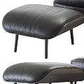 Luxurious Black Leather Accent Chair With Matching Ottoman And Wool Blanket