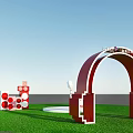 Red Headphone Shaped Event Entrance Arch For Vannele Festival With Decorations On Grass Field