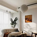 Bright Modern Beige Sofa Coffee Table Combination With Natural Light Green Plant And Wall Art