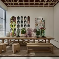 Flowers and Plants Arranged on Long Wooden Table in Bright Indoor Space with Decorative Vases