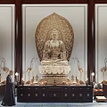 Golden Buddha Statue in Indoor Religious Setting with Worshiper Offerings and Incense Burner
