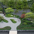 Rockery Stones In Outdoor Garden Landscape With Lush Green Plants And Gazebo