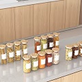 Clear Glass Spice Jars With Wooden Lids For Various Spices On Kitchen Countertop