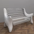 Unique Public Bench With Curved Speckled Arms And Metal Slats On Herringbone Wooden Floor