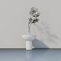 White Marble Vase With Green Leafy Plant On Fluted Pedestal Against Light Smooth Floor