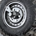 Off Road Tire Featuring Worn Tread And New Wheel Hub Mechanical Parts