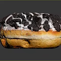 Delicious Golden Brown Donut Topped With Chocolate Crumbs And White Icing