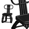 Modern Black Rattan Chair Featuring Woven Details And Ergonomic Structure For Home Use