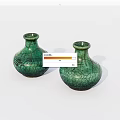 Two Green Ceramic Vases With Crackle Texture On White Background