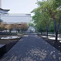 Urban Garden Landscape With Dark Paved Pathway Lush Trees And Central Water Feature
