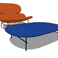 Orange Lounge Chair And Blue Oval Coffee Table In Modern Living Room Interior Design