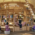 Outdoor Garden Landscape With Tent Structure Wooden Deck Bookshelves And String Lights