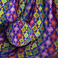 Colorful Woven Textiles Featuring Geometric Patterns And Vibrant Diamond Stripe Designs