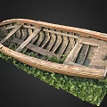 Old Wooden Boat With Weathered Planks And Frame On Green Grass